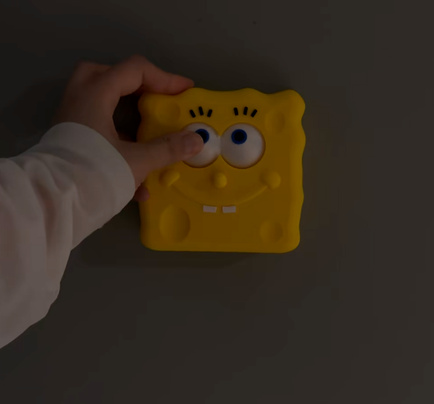 3D-printed Squidward "eyes open/closed" switch panel
