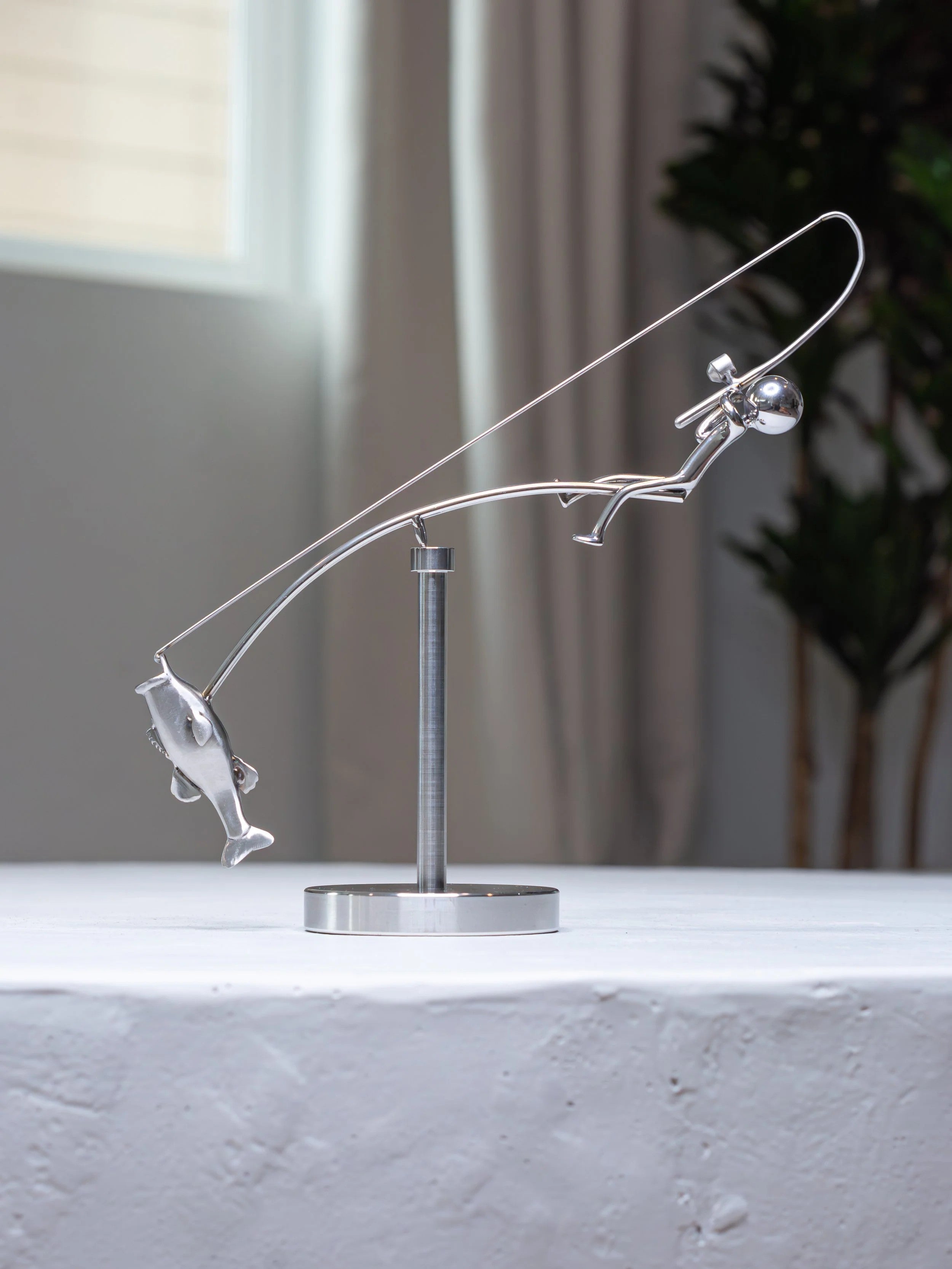 Stainless steel fishing rod and perch balance sculpture