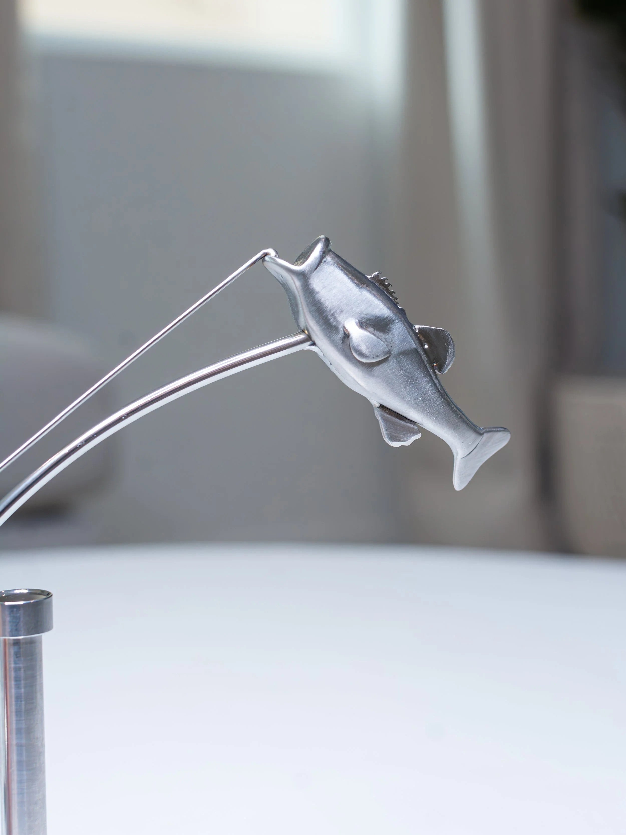Stainless steel fishing rod and perch balance sculpture