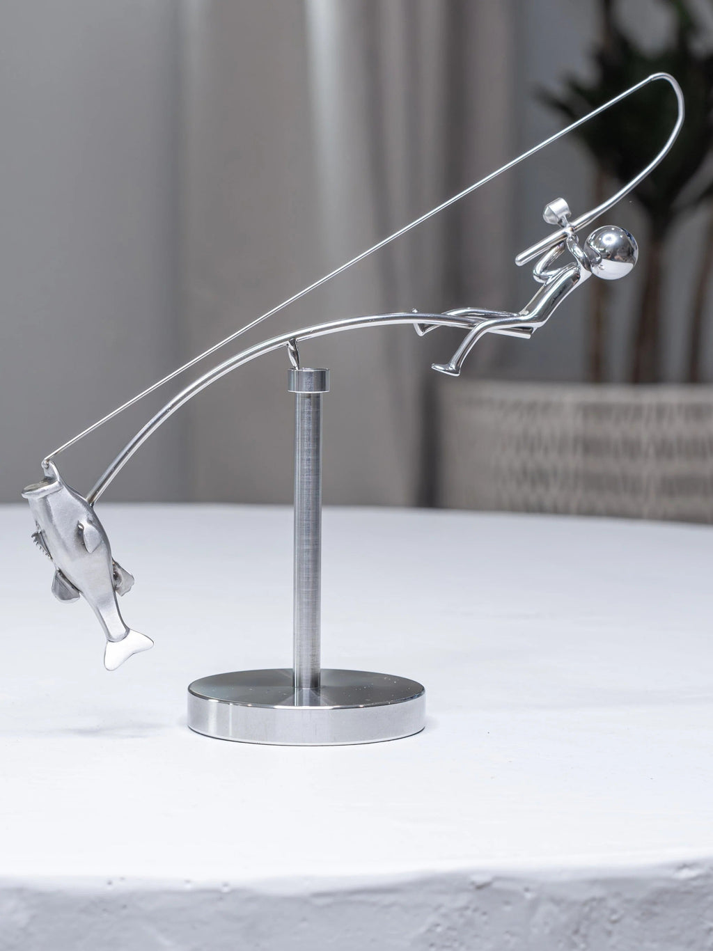 Stainless steel fishing rod and perch balance sculpture