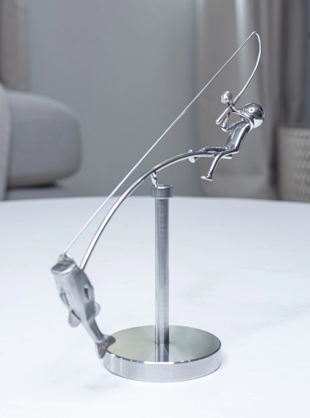 Stainless steel fishing rod and perch balance sculpture