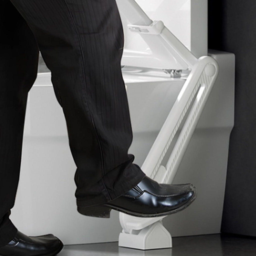 Foot-operated toilet seat lifter