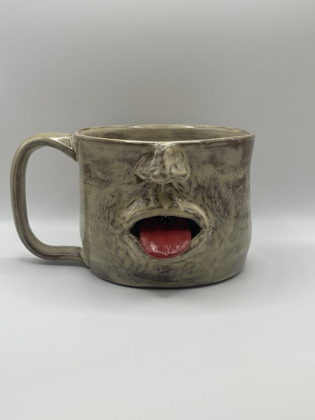 Handmade Ceramic Face Mug with Moving Tongue