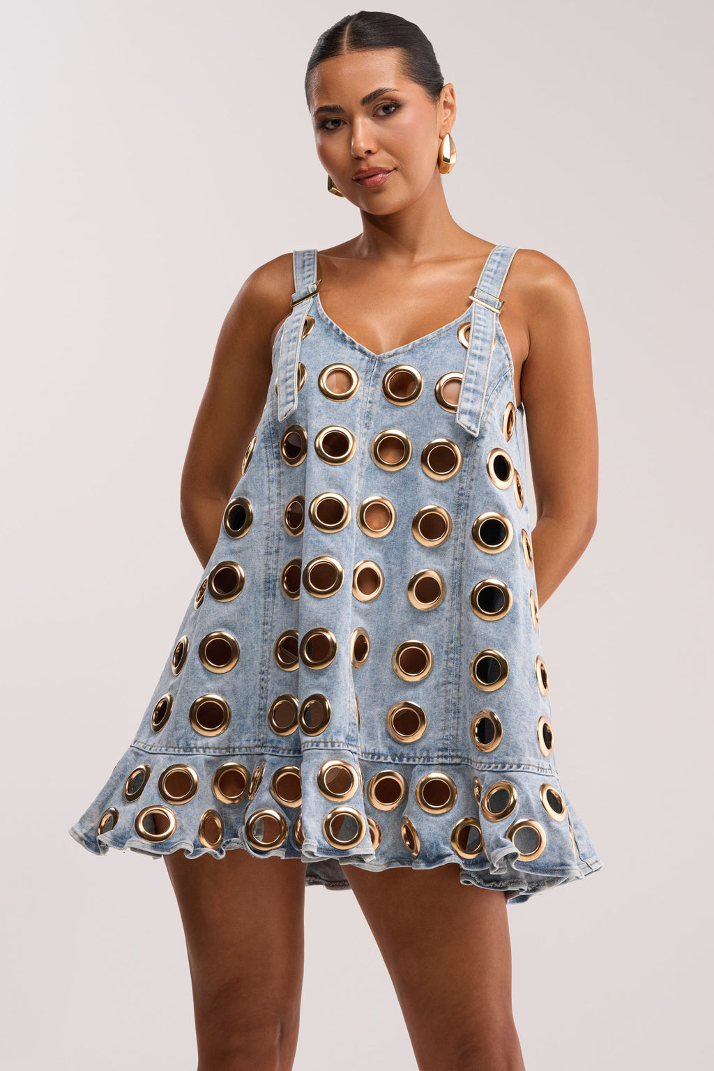 Light-wash denim-style mini dress with metal eyelet details
